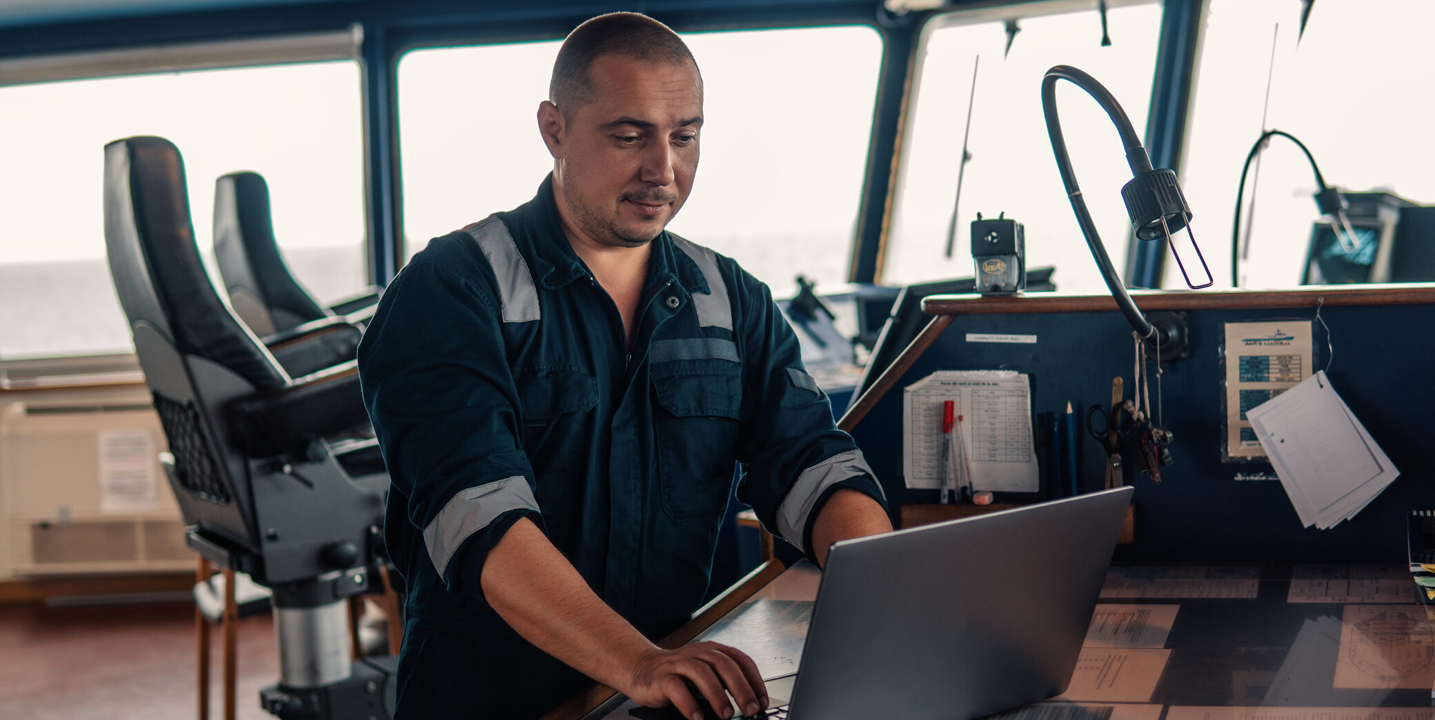 Vessel engineer using a laptop