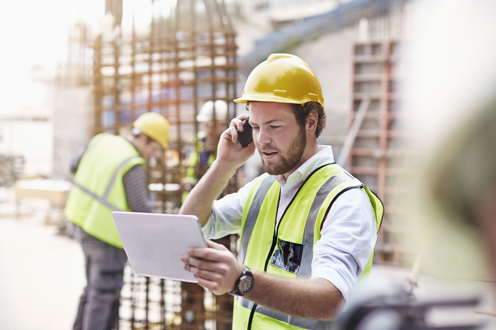 construction worker working on site on the phone