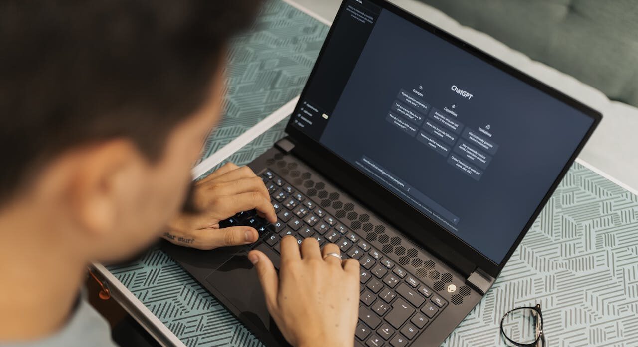 person using chatgbt on his laptop