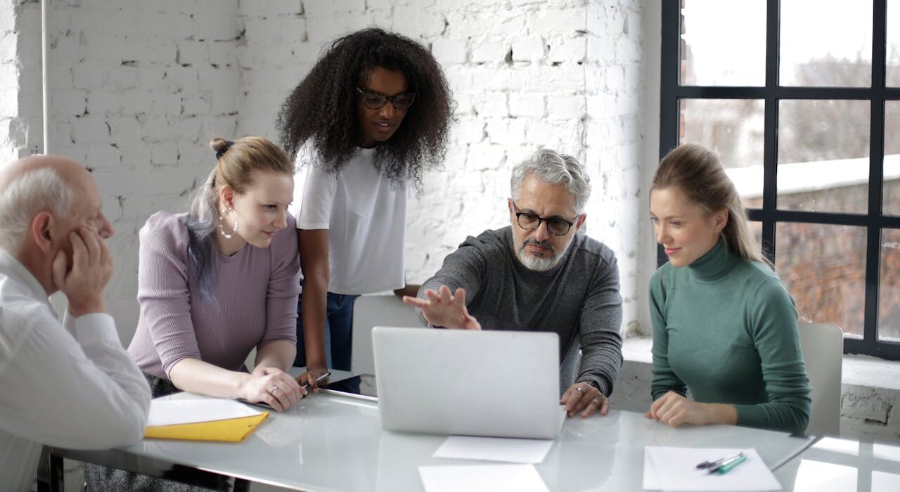 People analyzing business costs