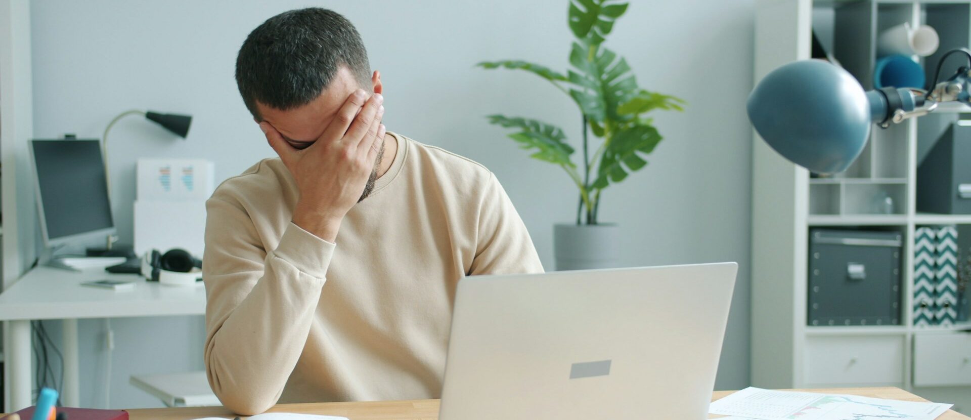 Concerned person in front of laptop