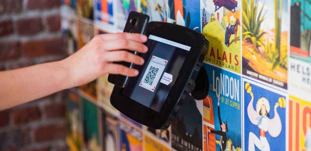 person scanning qr code with a smartphone