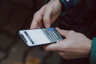 person getting a phishing message on a smartphone